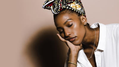 a woman resting her face in her hand